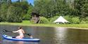 girl on a paddle board at Lystang Glamping