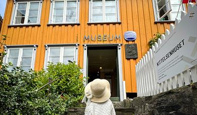 Girl outside the Kittelsen House in Kragerø.