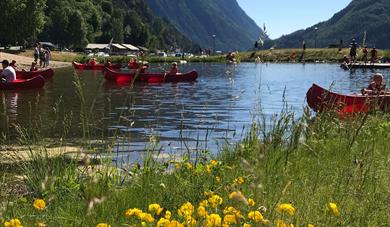 Beach with water and surrounding mountains