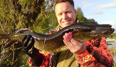 man holding a fish