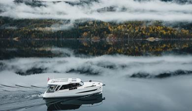 electric boat from Canal Boats Telemark on the way up the Telemark Canal