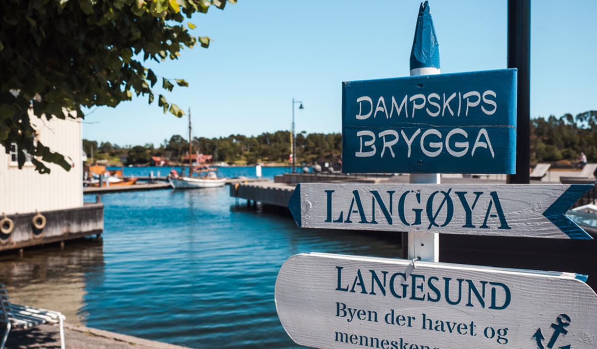 sign on the Dampship pier in Langesund
