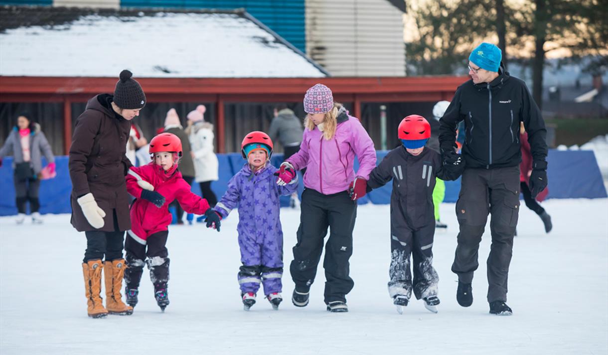 family on the skating rink in Skien leisure park