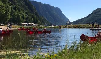 Beach with water and surrounding mountains