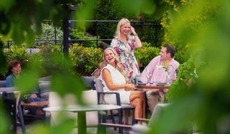 group of ladies enjoying themselves in the outdoor area at Becks Brasserie and Bar Osebro in Poragrunn