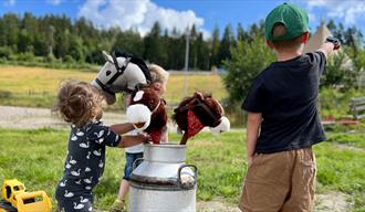 children with hobby horses at Brekka Farm in Skien