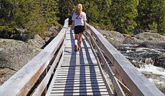 girl walking across a bridge at Mjonøy