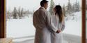 couple on a floating sauna in winter