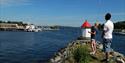 boy and man fishing in Langesund