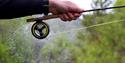 man holding fishing rod