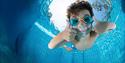 boy diving into pool at Skien fritidspark