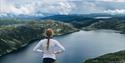 girl standing on topp of Mount Toreskyrkja