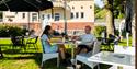 couple sitting in the garden at the Station cafe