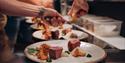 chefs at restaurant Jacob & Gabriel put food on the plate