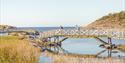 cyclists cycle across the bridge at Krogshavn in Bamble
