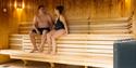Couple enjoying themselves in the sauna.