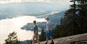 couple enjoying the view from the top of Eikeskartoppen