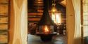 cabin with a beautiful fireplace at Bolkesjø Gård