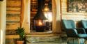 cabin with a beautiful fireplace at Bolkesjø Gård