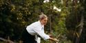 Host picking herbs in the garden of Nutheim Guesthouse