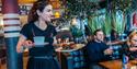 waitress at Jonas B Gundersen in Porsgrunn with food