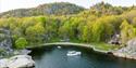 boat from Canal Boats Telemark is located in a bay
