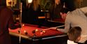 guests play billiards at Gamle Polet Spillbar