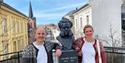 Henrik and Linnea from Telemark Museum at Henrik Ibsen bust