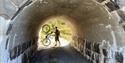 cyclist in a barrel on the cycle path "culture round" in Drangedal