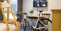 room at Lunde Vandrerhejm with bicycle standing in front of table