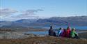 group sitting and looking out over the landscape