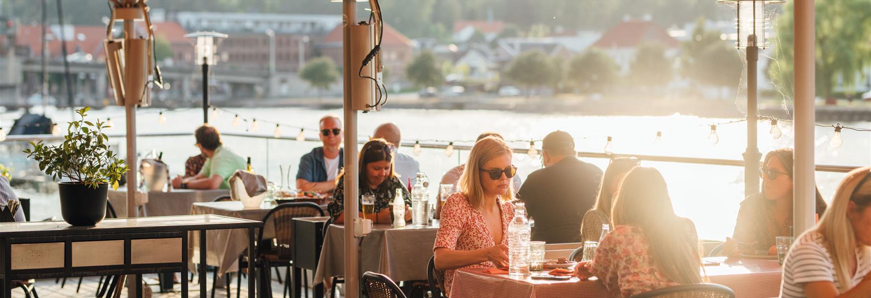 people sitting at an outdoor restaurant in Porsgrunn