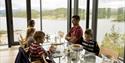 family enjoying themselves at Panorama Kafe at Hardangervidda National Park Center