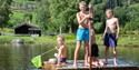 boys standing on a bathing platform