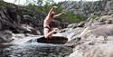 girl jumps in water in the giant pots in Nissedal