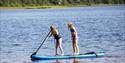 2 girls on a SUP